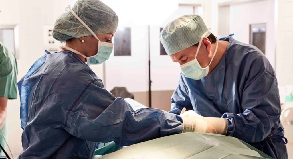 Dr. Wohlt performing vocal cord surgery